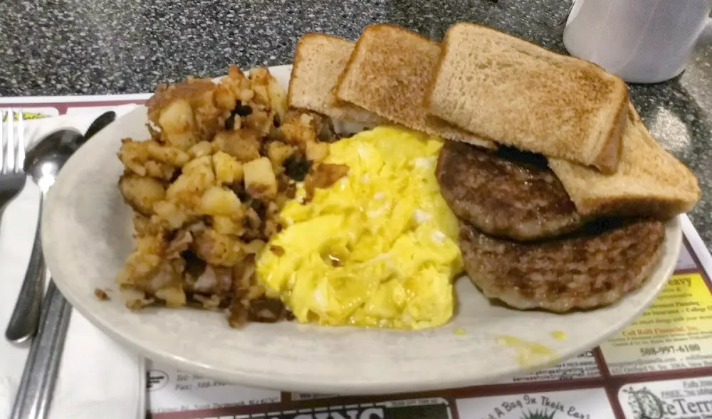 2 Eggs Scrambled Sausage Home Fries and Toast